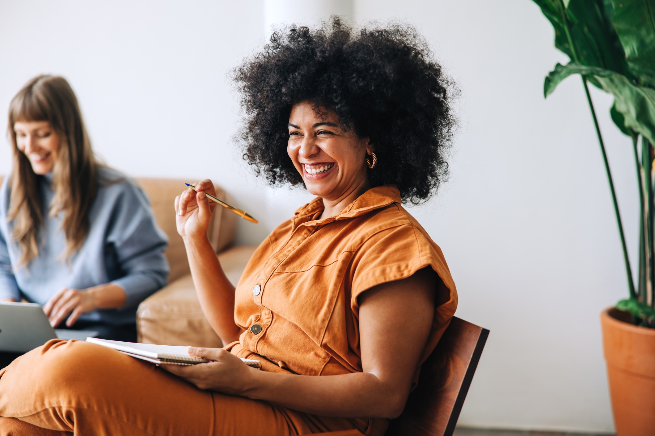 a happy businesswoman smiling in a meeting